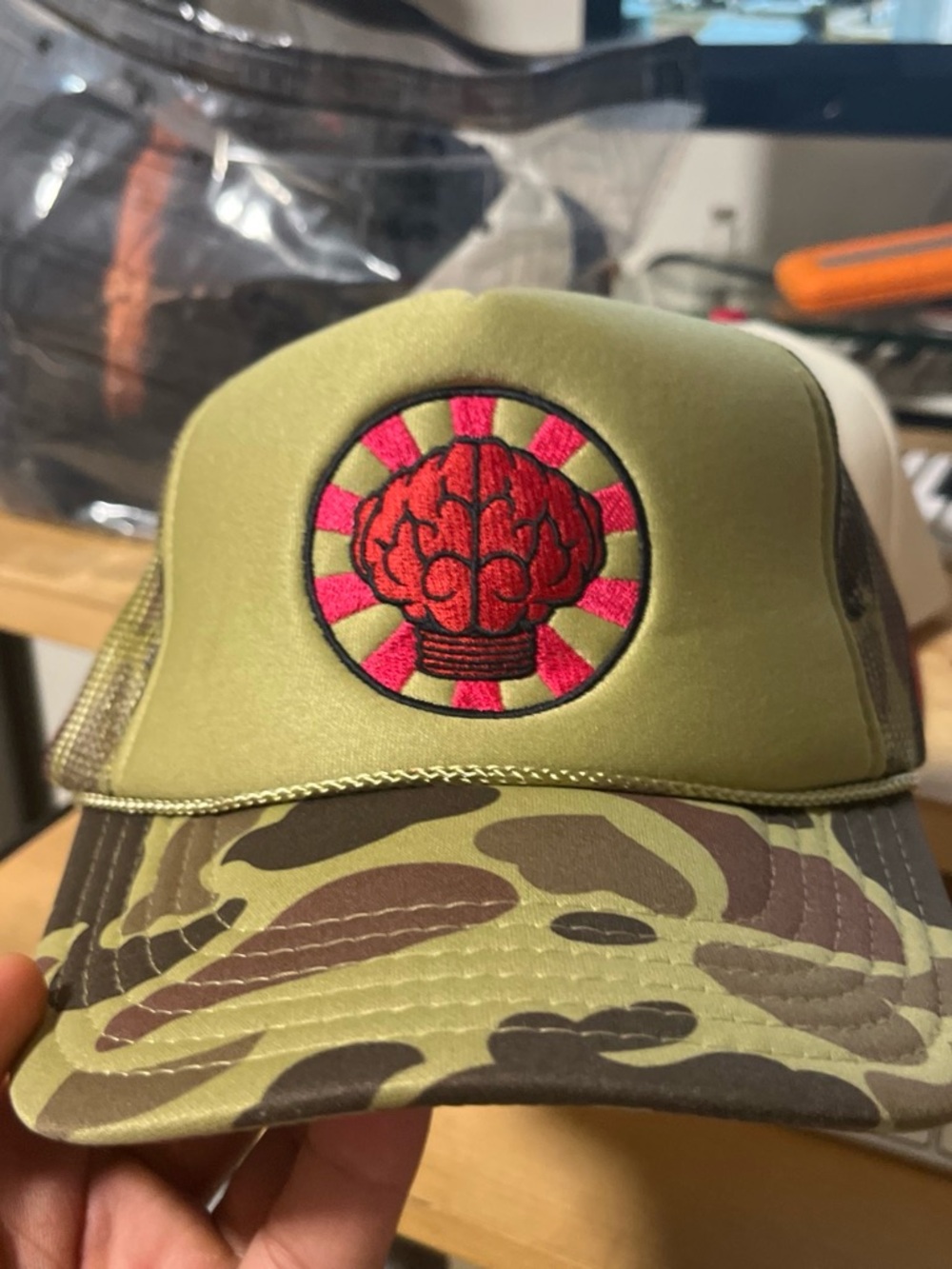 NERD Olive Green Camo Trucker Hat with Pink Embroidered Patch